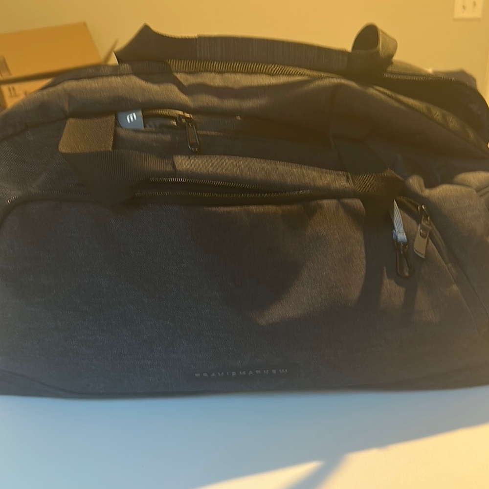 Travis Mathew Black Duffel Bag with Sleek Design